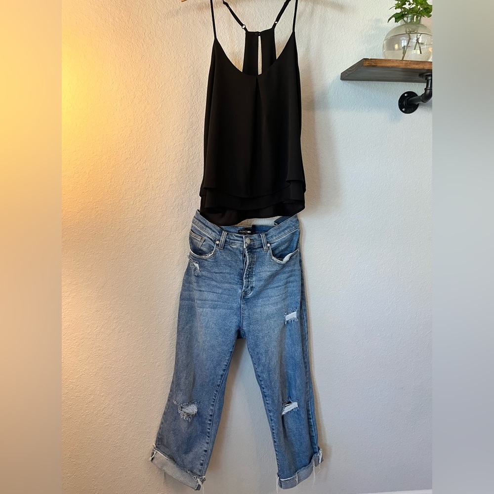 Black racerback top w/adjustable straps & button closure at the back of the neck
